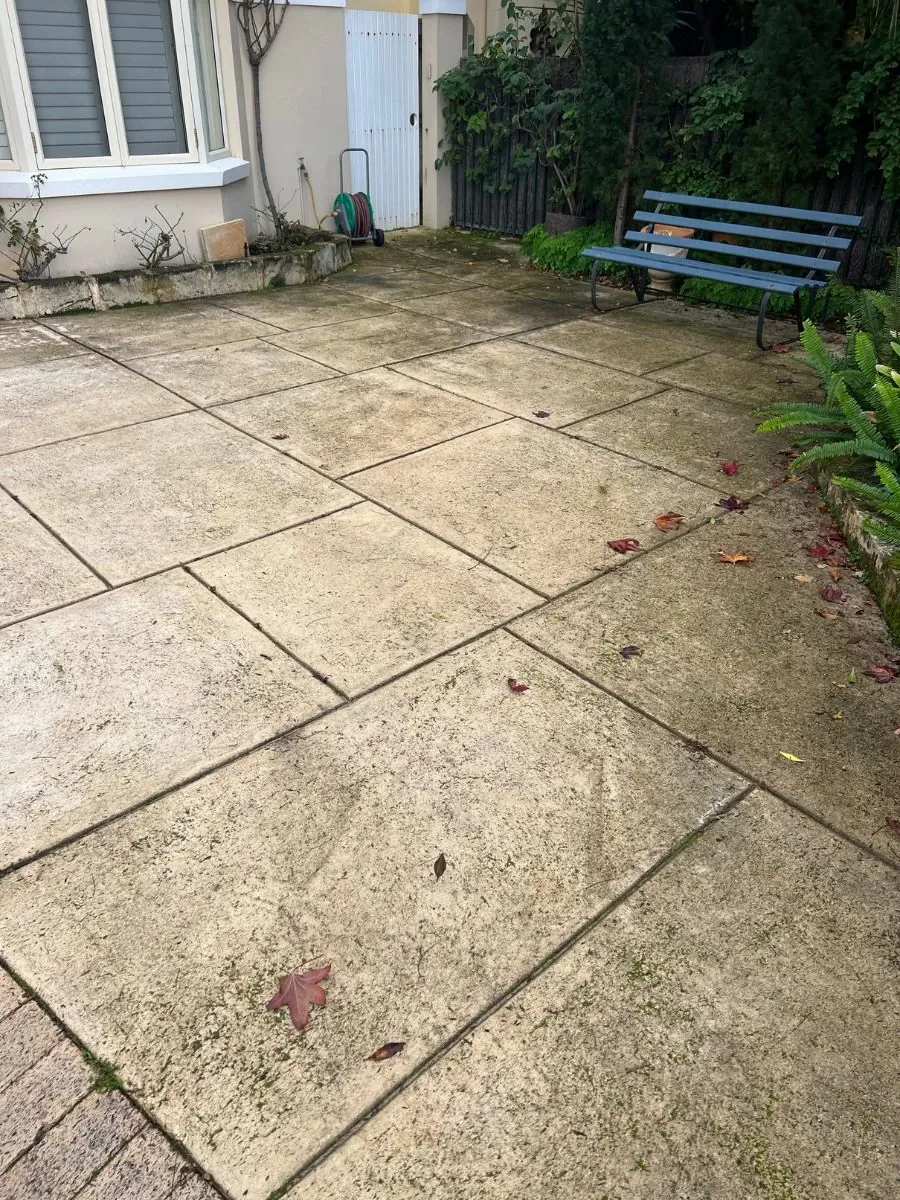 Limestone courtyard before cleaning
