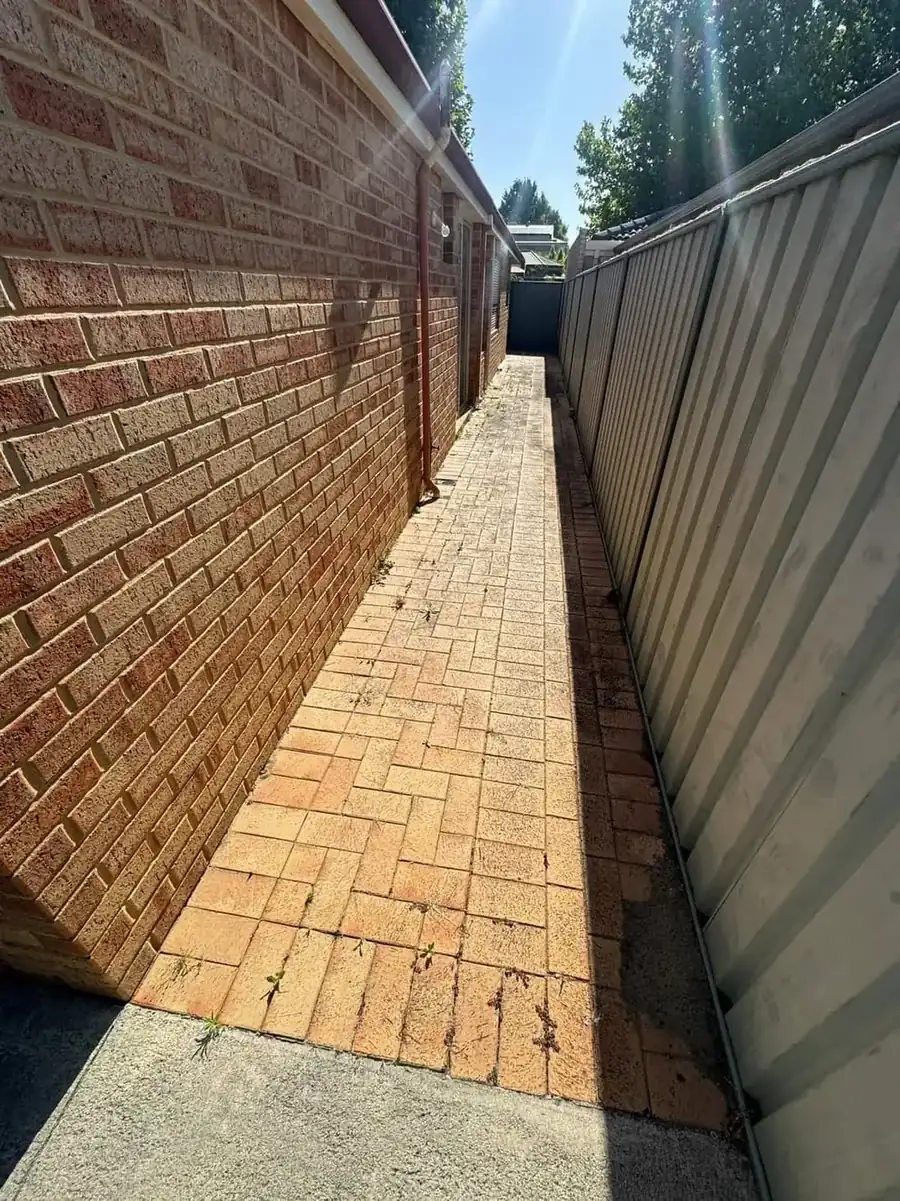 Paved courtyard in Perth before cleaning, greyed and stained
