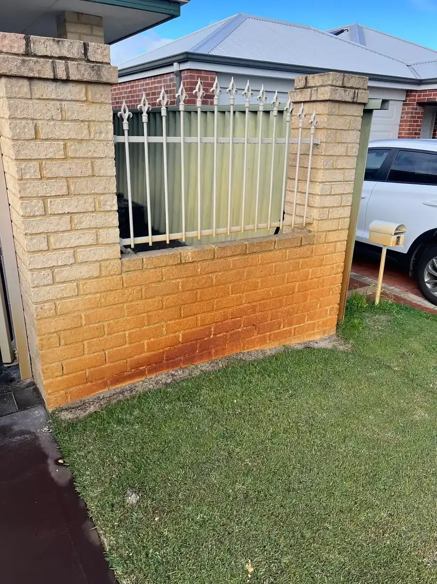 Bore-water staining on paving before treatment