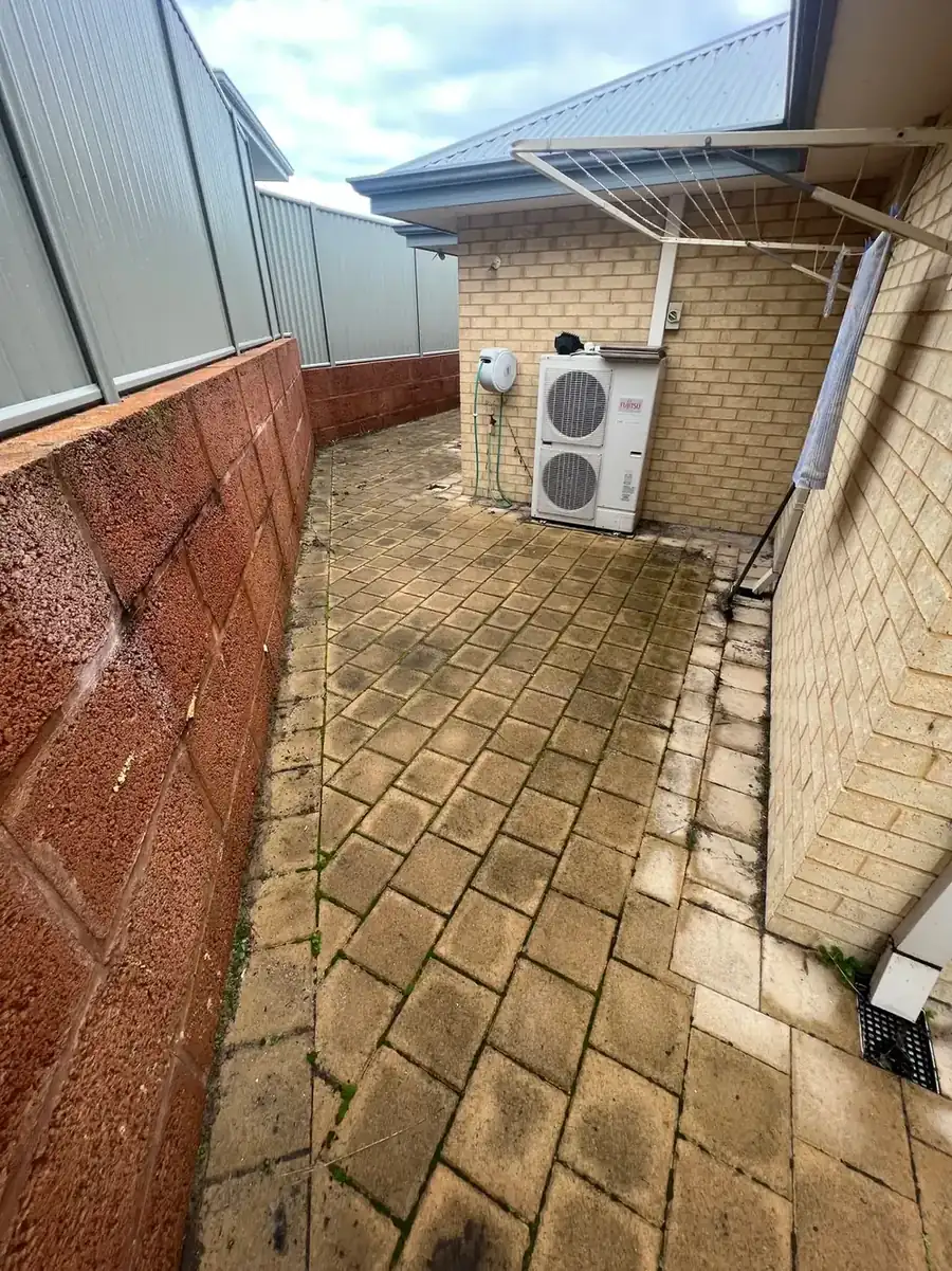 Paved patio courtyard before cleaning