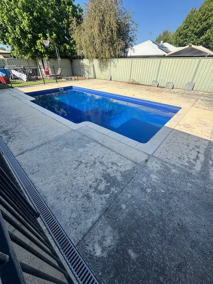 Limestone pool surround before cleaning