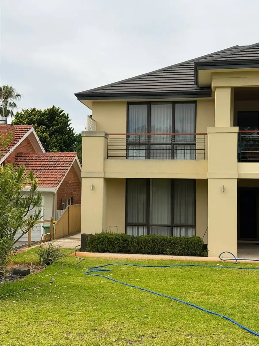 Rendered house exterior before a soft wash