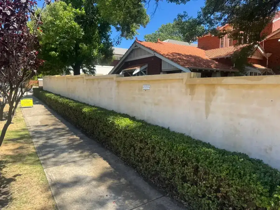 Limestone boundary wall after a soft wash in Perth